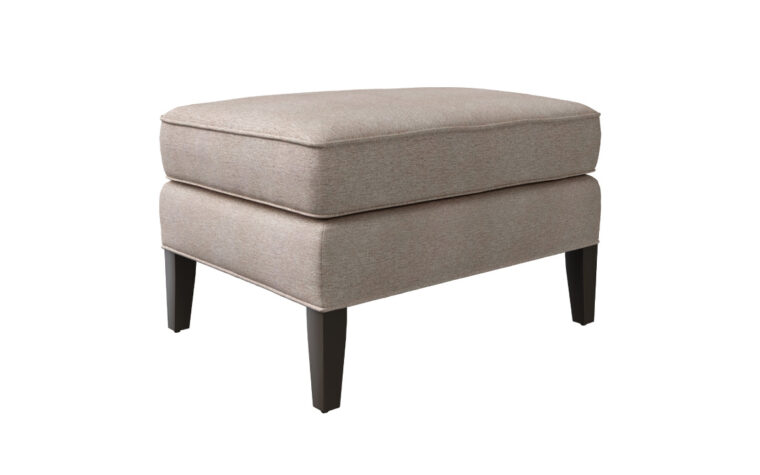 Angled shot of the Birkley Ottoman by Vogel in a taupe fabric cover with espresso legs