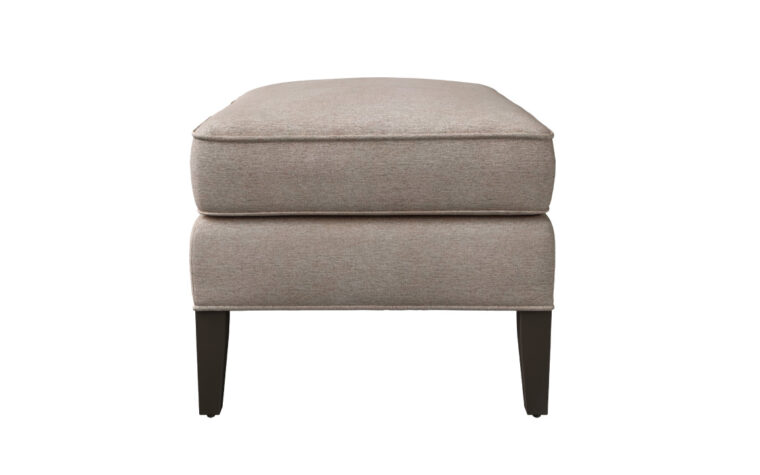 End shot of the Birkley Ottoman by Vogel in a taupe fabric cover with espresso legs
