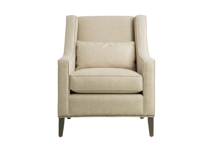Front shot of the Eloise lounge chair by Vogel showcasing neutral fabric, espresso wood finish, and nail head trims