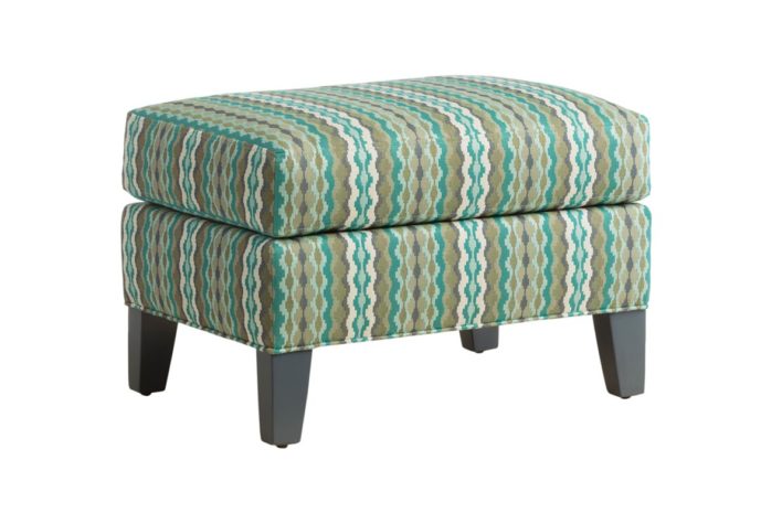 Angled shot of the Aeriel ottoman by Vogel in bright blue, green, and brown striped fabric
