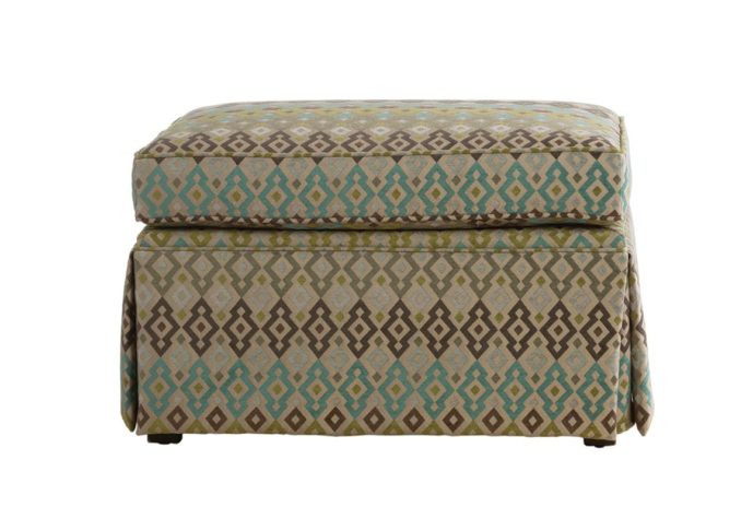 Tessa ottoman by Vogel with a skirt and a brown and blue fabric cover