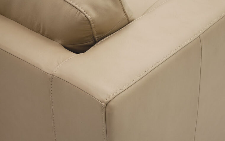 detail shot of transitional jura sectional in cream leather