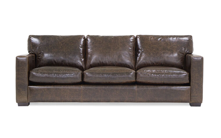 contemporary brown leather colebrook sofa with three seat cushions and dark brown wood legs