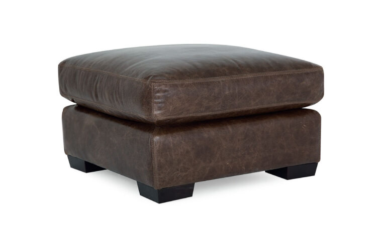 side angle of contemporary brown leather ottoman from the colebrook collection