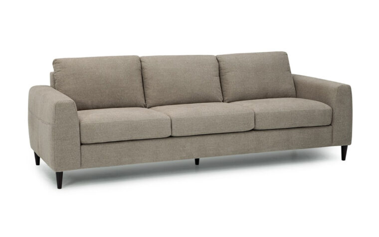 front angle of atticus sofa is a mid-century odern sofa with wooden legs and grey fabric
