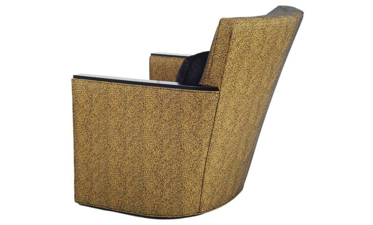 Back shot of the Max Swivel Chair from Vogel by Chervin in a mustard yellow fabric with espresso wood-top arms and a black kidney pillow