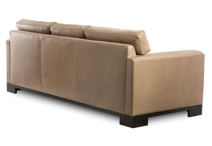 Back shot of the contemporary Julius sofa from Vogel by Chervin in a tan leather and espresso wood finish