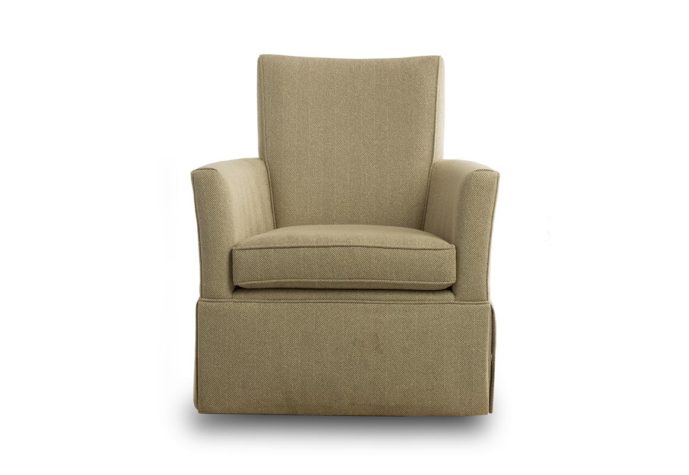 transitional skirted swivel chair in a light tan fabric with clean lines