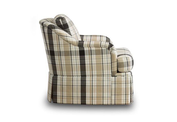 Side shot of the traditional Cassidy swivel chair in a plaid fabric with a skirt