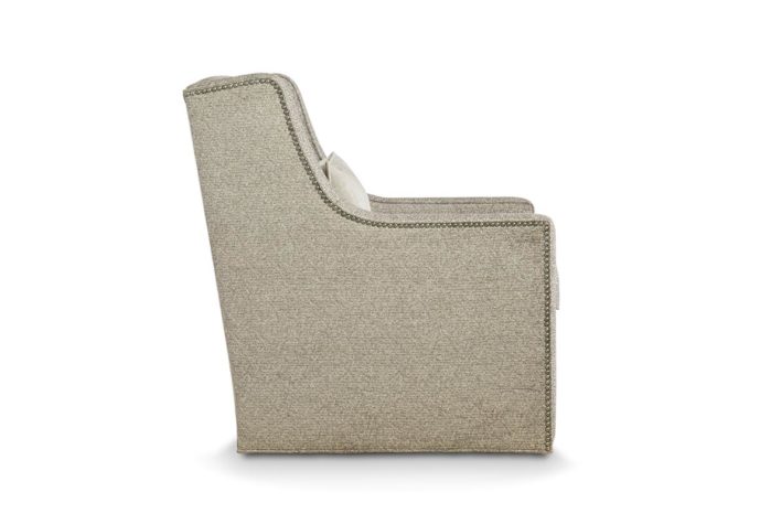 Side view of the transitional Eloise swivel chair in beige fabric with metal nail head trim and lumbar pillow in same fabric