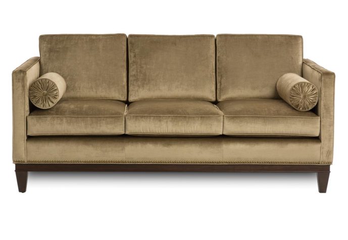14107 sofa shown in velvet fabric with espresso wood finish and nailhead trim