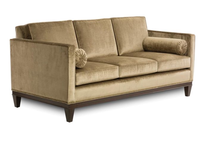 front angle of 14107 sofa shown in velvet fabric with espresso wood finish and nailhead trim