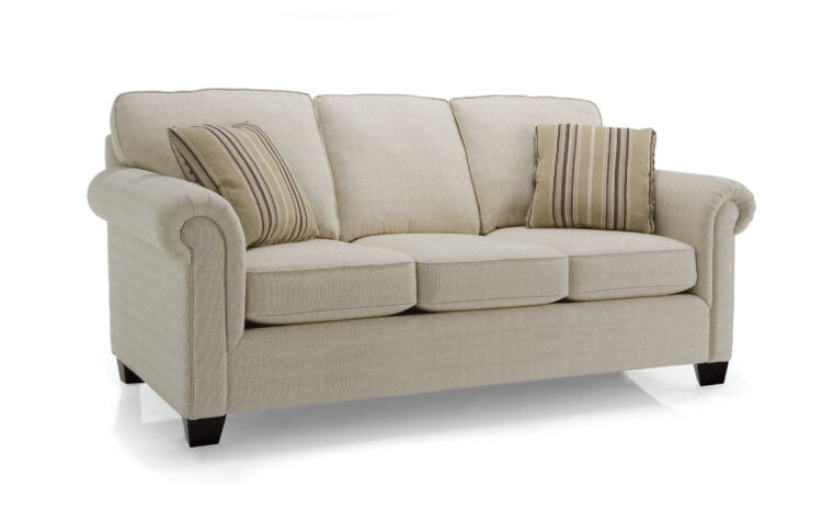 traditional sofa with nailhead trim shown in a white fabric with fun accent pillows