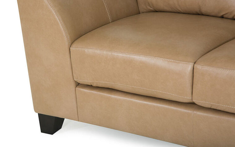leg and arm details of juno sofa is a contemporary sofa in a tan leather with espresso wood finish