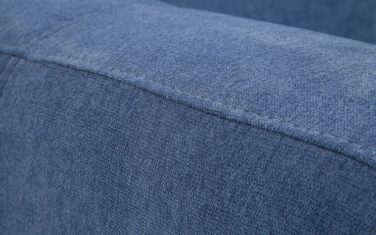 seam details on juno chair is a contemporary chiar in a blue velvet fabric with espresso wood finish