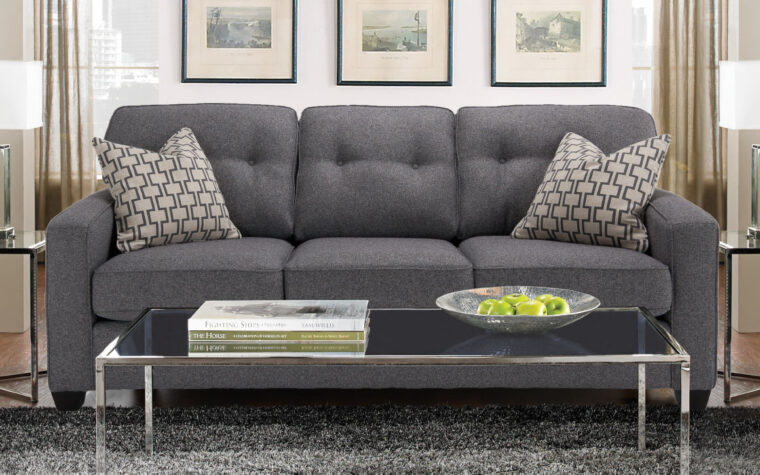 2298 sofa is a transitional sofa in a dark charcoal fabric with tufted back cushions
