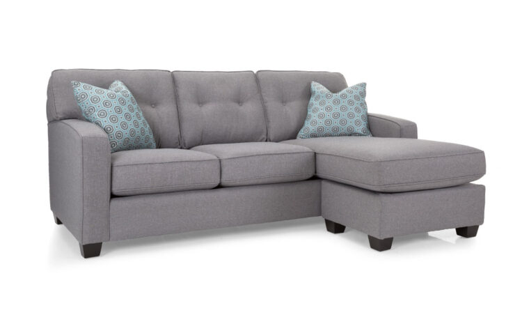 2298 sofa with chaise is a transitional sofa with chaise shown in light grey fabric with contrasting blue pillows and button tufted back cushion
