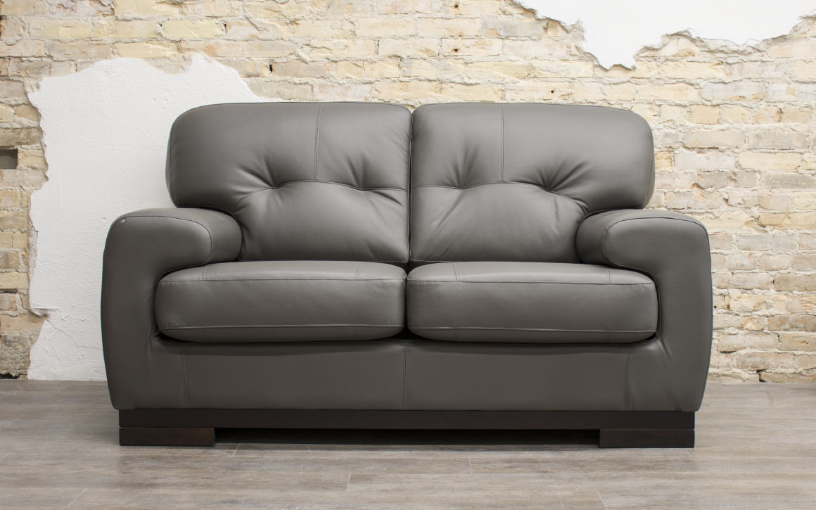 St Lawrence Loveseat upholstered in grey leather in Chervin Furniture & Design showroom (Elmira)