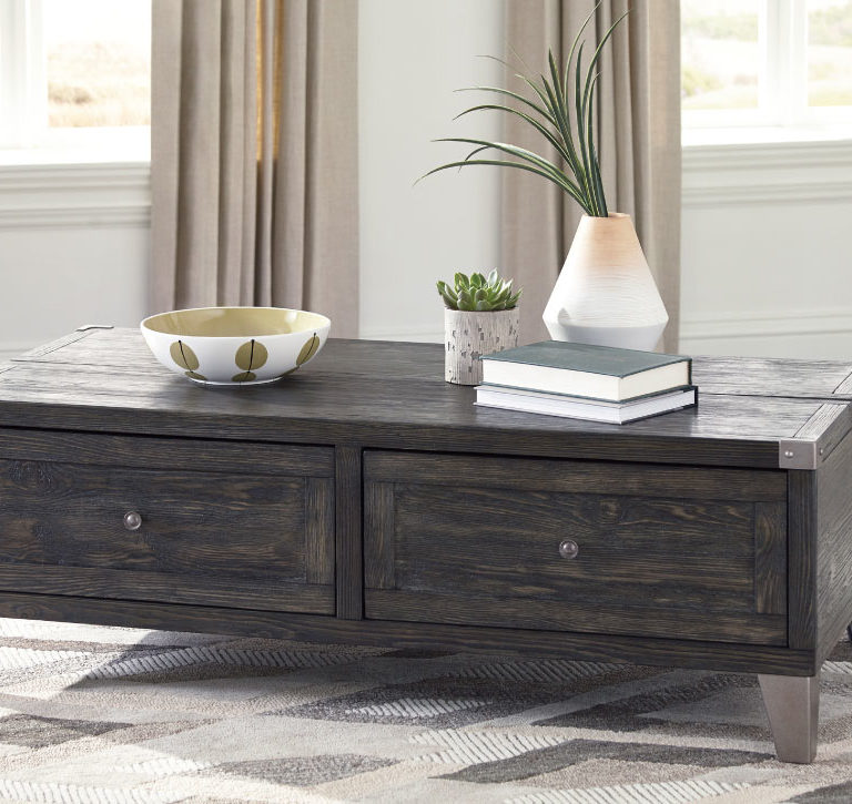 todoe cocktail table has a lift feature, grey distressed wood finish and two drawers with metal looking legs