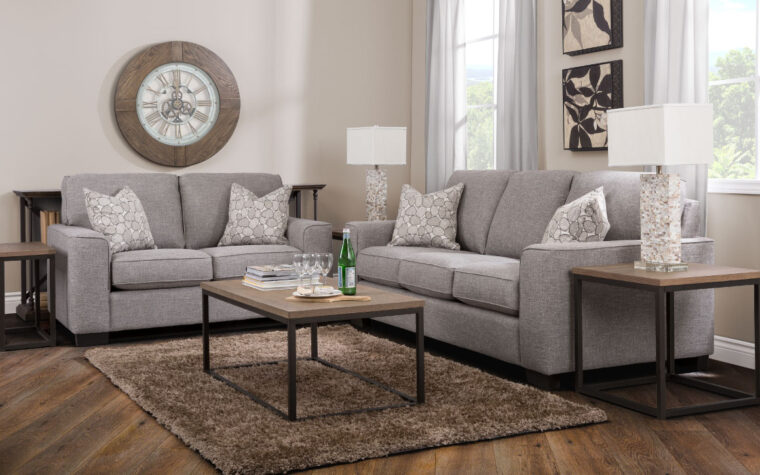 2483 sofa is a contemporary sofa in a living room with a rug and loveseat shown and an oversized gallery wall clock