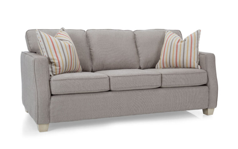2570 sofa is a light grey sofa with fun, striped, colorful pillows with weathered ivory finish