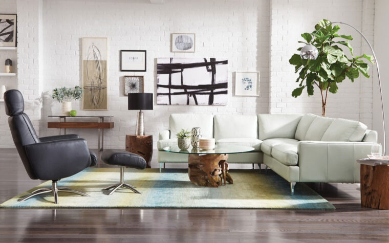 remington sectional is shown in a room setting with mid-century modern decor and a black chair