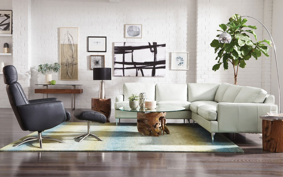 remington sectional is shown in a room setting with mid-century modern decor and a black chair