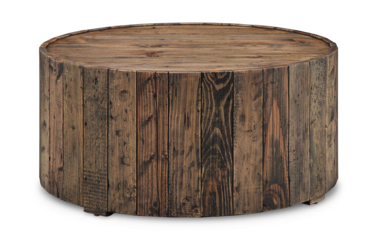 The Dakota Cocktail Table by Magnussen is constructed from reclaimed wood and has a rustic pine finish