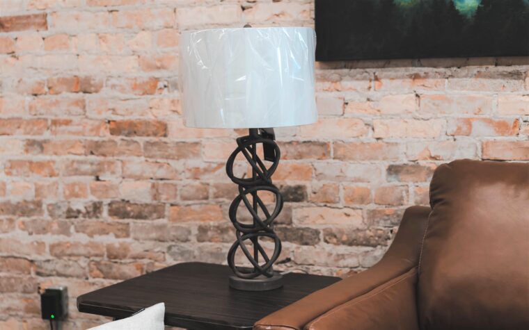 lamp with white light shade on end table