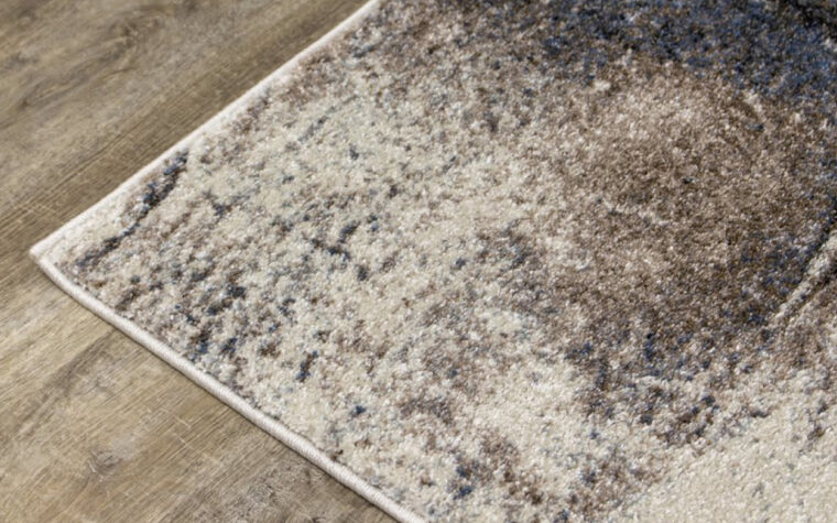Breeze II Area Rug by Kalora - floor rug with marbled design of cream, black, brown, and teal blue (close-up)