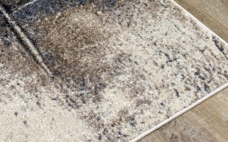Breeze II Area Rug by Kalora - floor rug with marbled design of cream, black, brown, and teal blue (close-up)