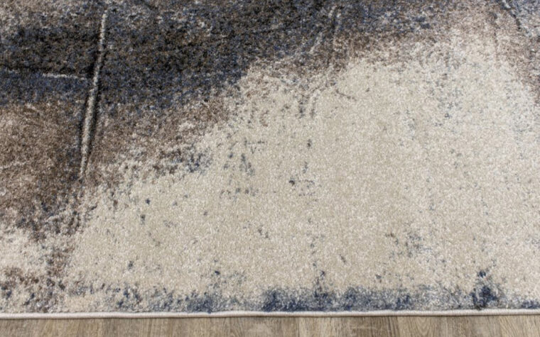 Breeze II Area Rug by Kalora - floor rug with marbled design of cream, black, brown, and teal blue (close-up)