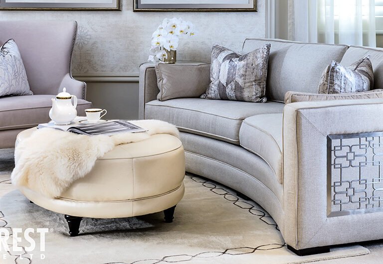 Curved sofa 9815 by Decor-Rest with silver metal accent detailing on the side/arm