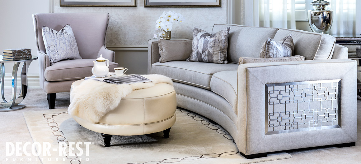 Curved sofa 9815 by Decor-Rest with silver metal accent detailing on the side/arm