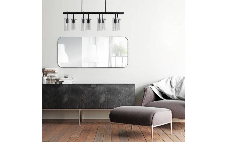 Delphinus Mirror - Renwil - rounded rectangle, full length mirror with thin metal frame; hanging on white wall above server with leather door fronts, beneath industrial ceiling light fixture and next to mauve mid-century modern furniture