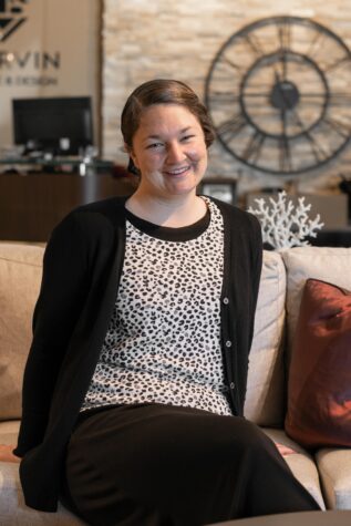Jody S. sitting on sofa