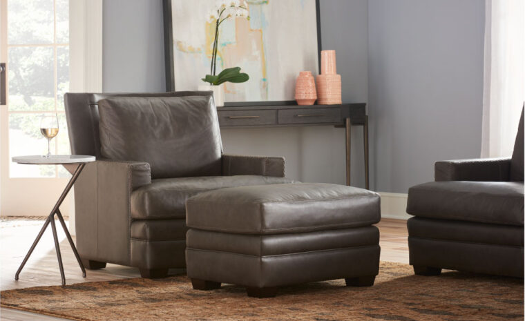 Round end table in living room with a stone top and metal base