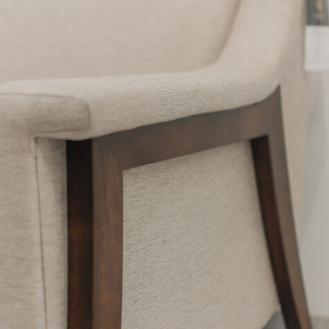 Upholstered framed chair with wooden legs