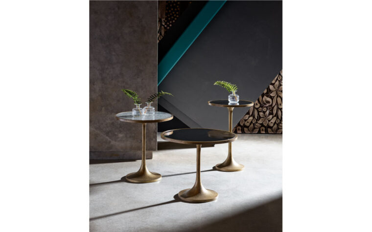 Three bunching tables in a room