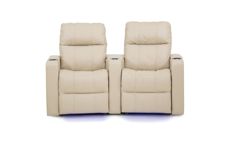 Front view of two tan leather upholstered theatre seats