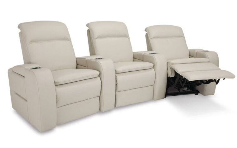 Angle view of cream leather theatre seating with recliner extended on the end
