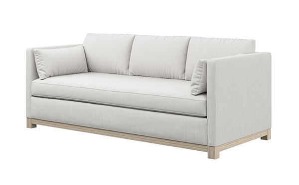 Modern and clean lined three cushion sofa on an angle