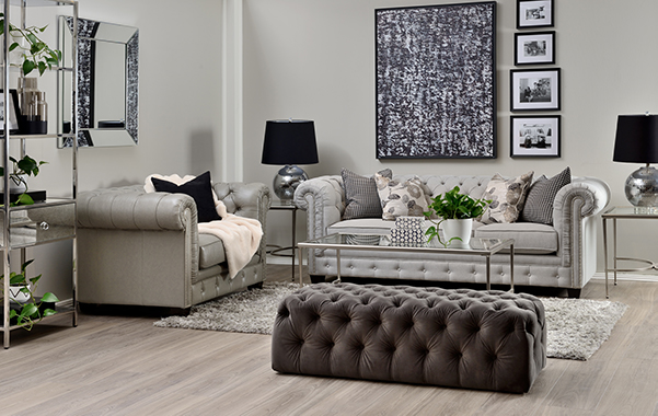 Tufted sofa with round arms in living room