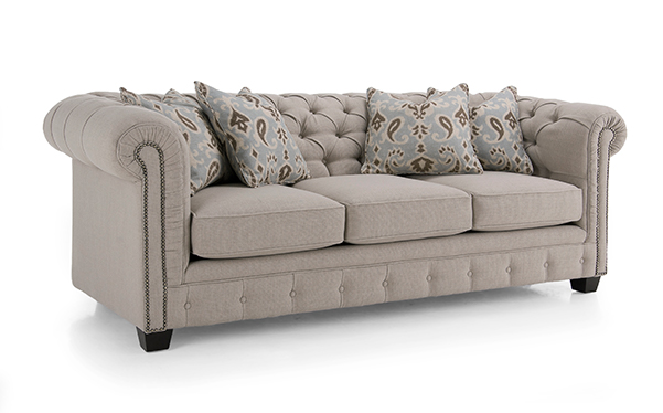 Tufted sofa with round arms