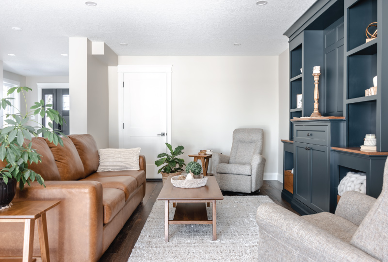 transitional living room with brown leather couch in elmria