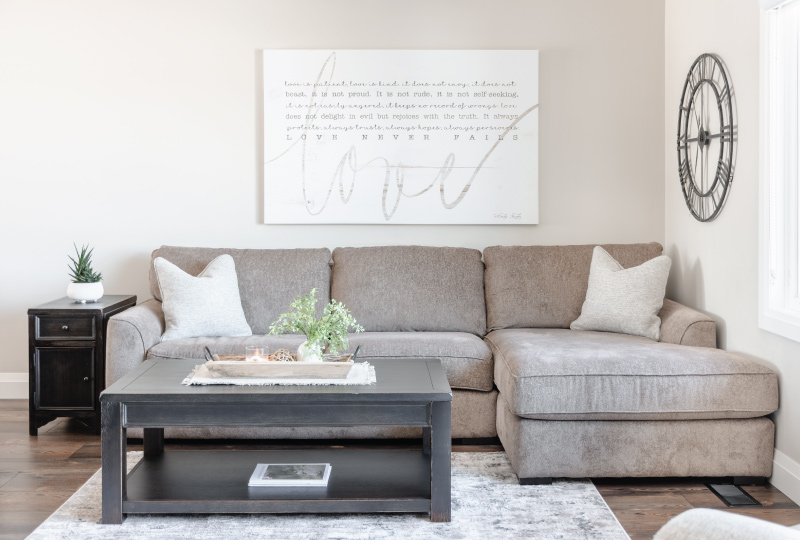transitional living room with grey sectional
