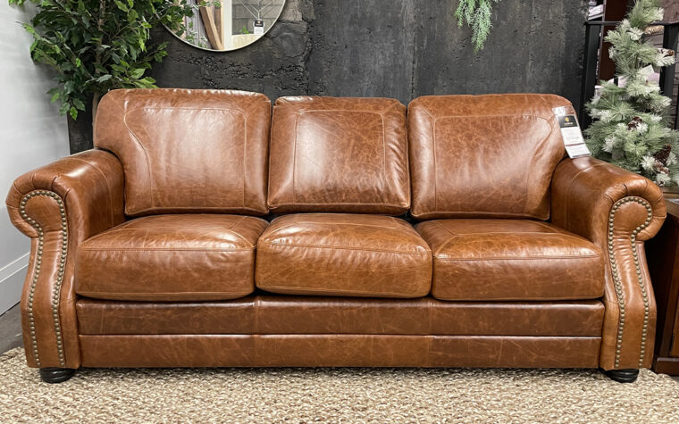 brown traditional sofa with curved arm