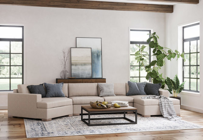 A living space with a large sectional featuring a cuddler corner and chaise end.