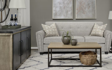 A modern-contemporary living space with a neutral convertible sleeping sofa bed from Decor Rest.