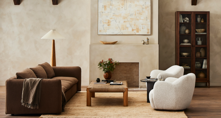 Four Hands modern brown sofa and white boucle chairs styled in modern living room.